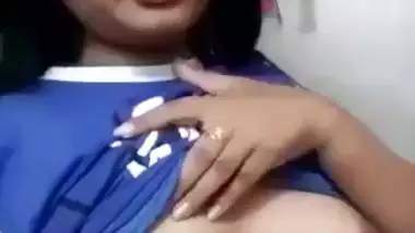 Beautiful desi girl lifting top to reveal sexy boobs